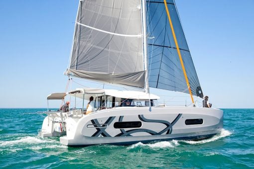 Sailing Excess 11 catamaran sailboat with people aboard