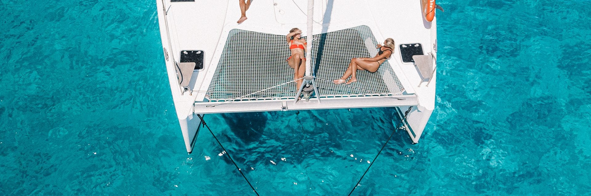 People enjoying deck of yacht in a brokerage ownership program