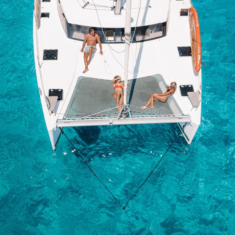 People enjoying deck of yacht in a brokerage ownership program