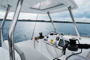 Sailing catamaran Bali 4.4 helm with mountains in distance