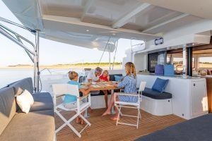 Family gathering around Lagoon 46 catamaran cockpit