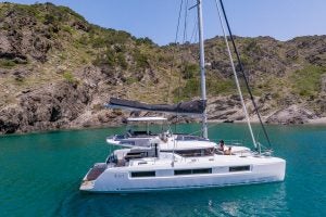 Couple sitting on deck of anchored Lagoon 51 yacht