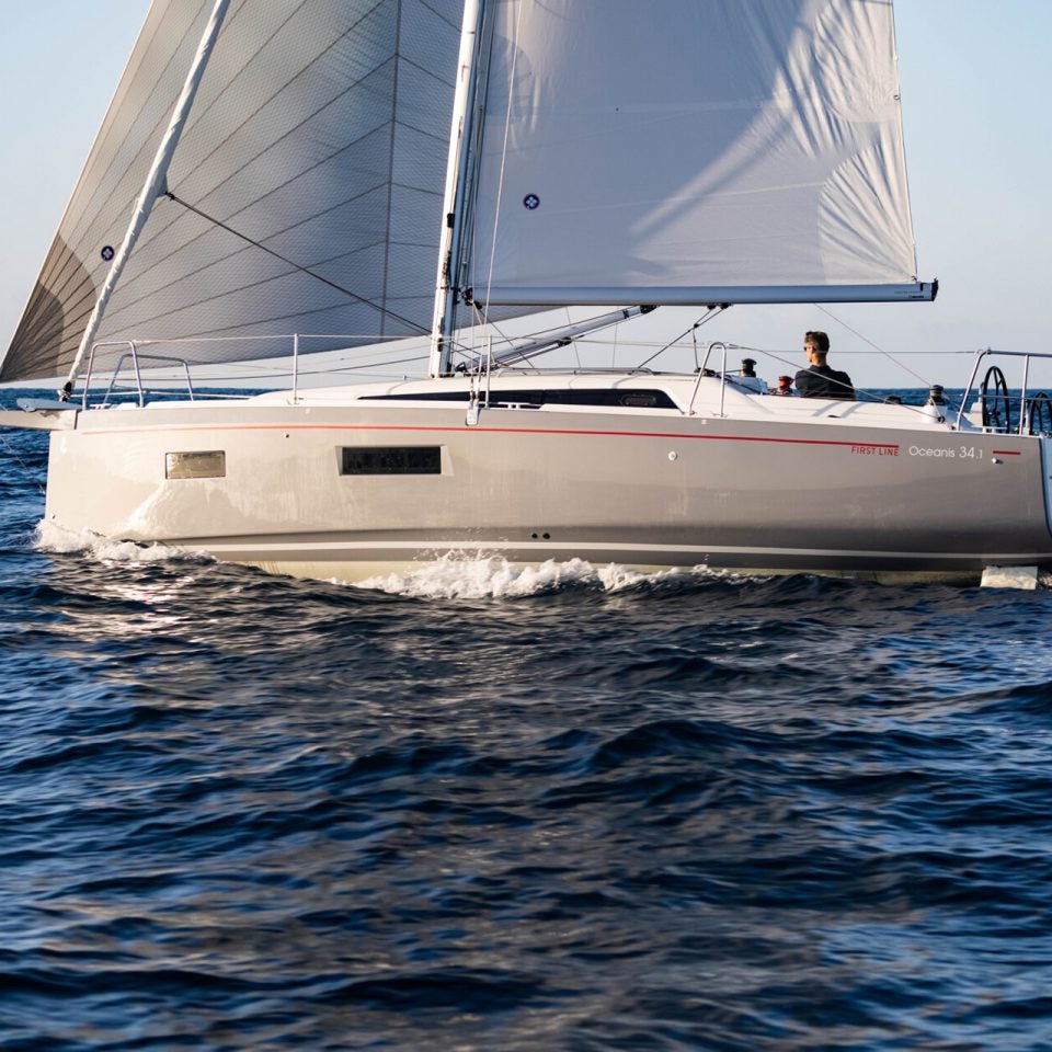 Beneteau 34.1 sailboat with sails up and man at helm