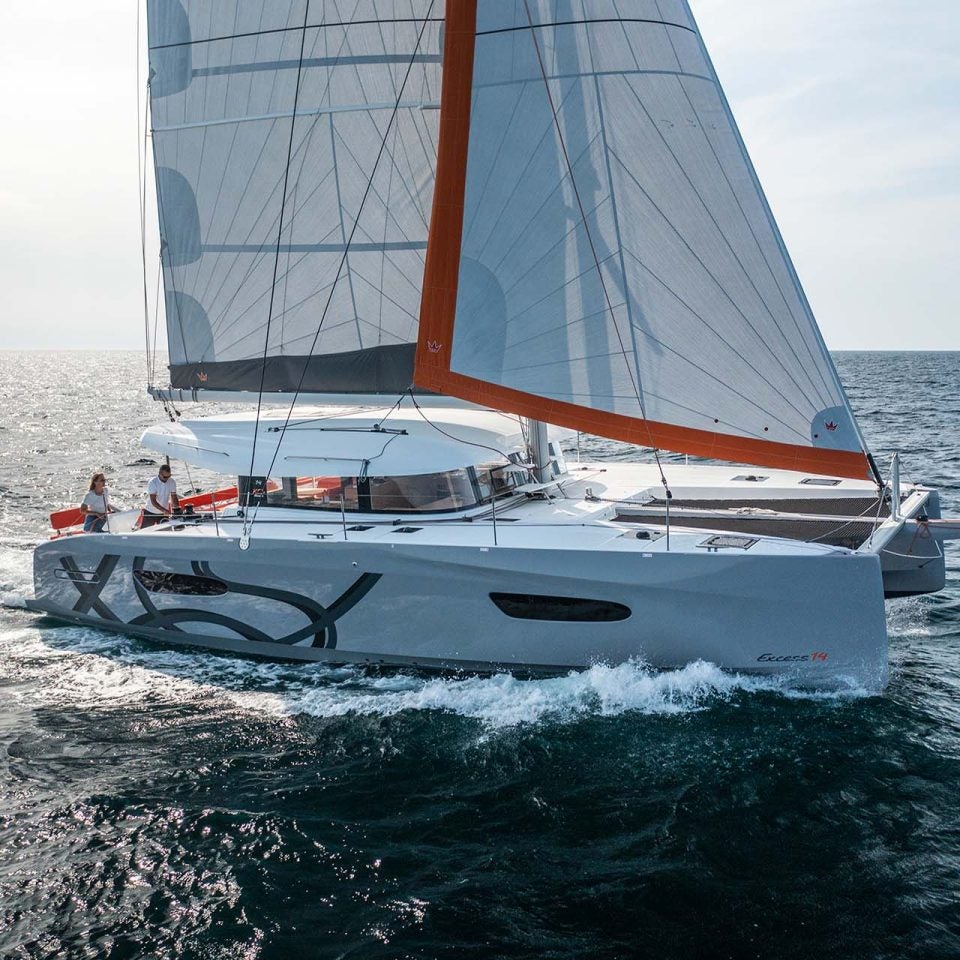 Excess 14 catamaran cruising with sails up