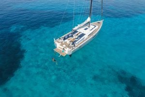 Beneteau 46.1 sailboat at anchor in bright blue waters