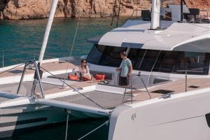 Couple on front deck of the Samana 59 luxury catamaran