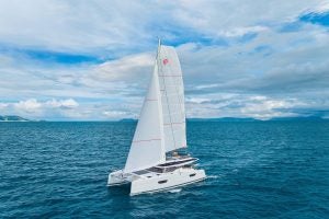 Fountaine Pajot Tanna 47 catamaran sailing with islands in distance