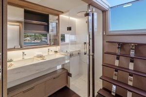 Lagoon 65 luxury yacht bathroom and door to outdoors