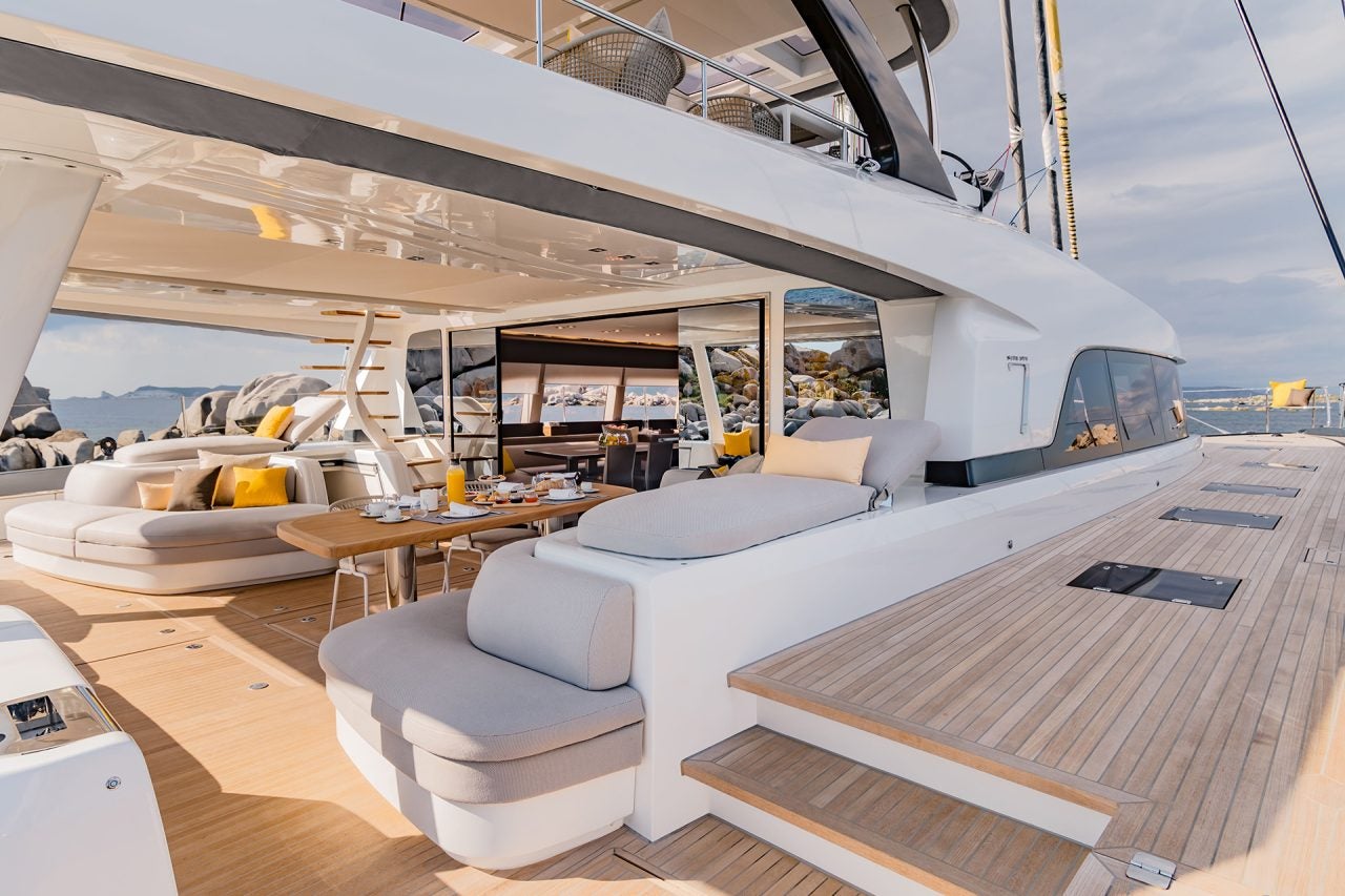 Wide view of cockpit and side deck of the Lagoon 77 catamaran