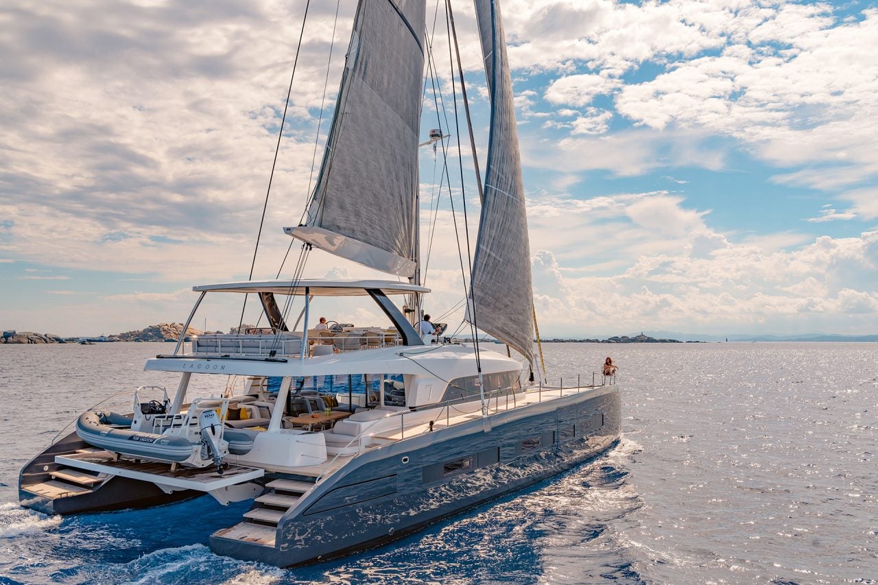 Lagoon 77 luxury catamaran cruising with sails up