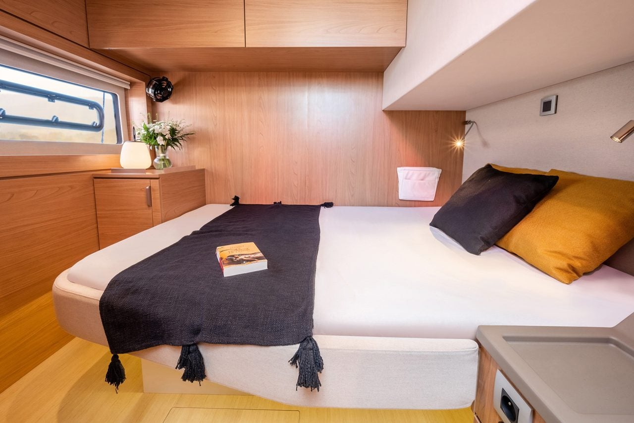 Large light wood cabin with double bed aboard a Bali 4.8 catamaran