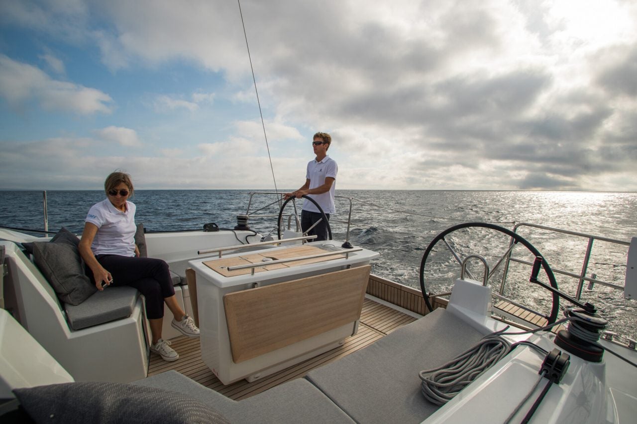 View from the cockpit of Beneteau 40.1 sailboat with man at helm