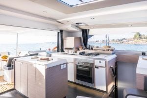 Smart electric Pajot Aura 51 catamaran galley and cockpit