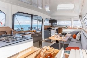 Excess 11 catamaran saloon with seating area and large windows