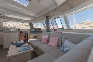 Fountaine Pajot 67 catamaran salon lounge area with wrap windows