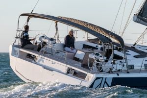 Dufour 470 smart electric monohull sailing with people in cockpit