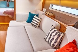 Cushioned seating of Sun Odyssey 440 sailboat salon