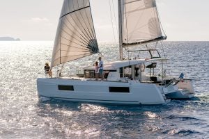 Family on deck of the Lagoon 40 catamaran at sail