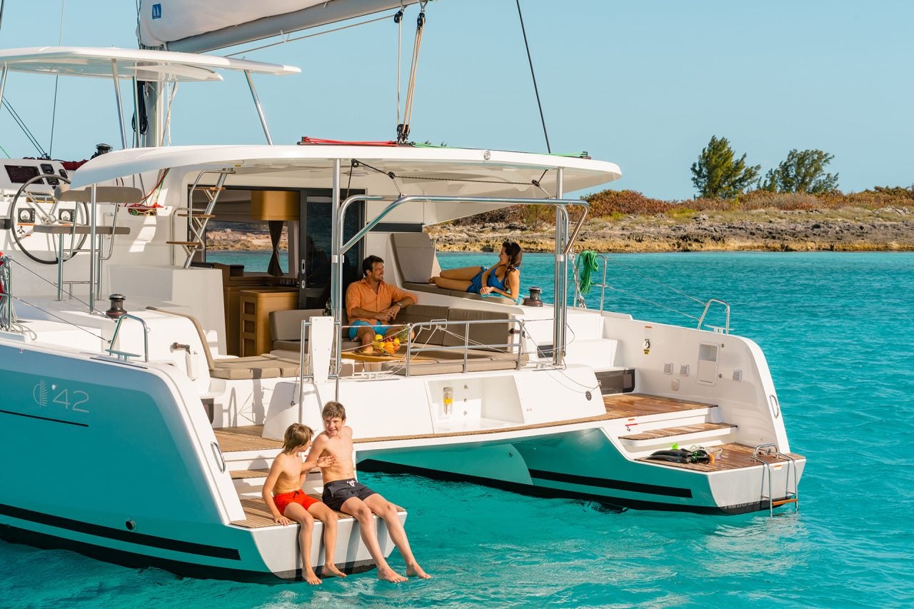 Couple relaxing in the cockpit of the Lagoon 42 catamaran