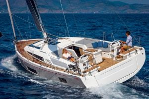 Beneteau Oceanis 46.1 monohull at sail with man at helm